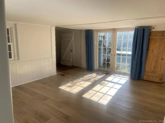 a view of entryway with wooden floor