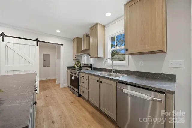 a kitchen with a sink stove and cabinets