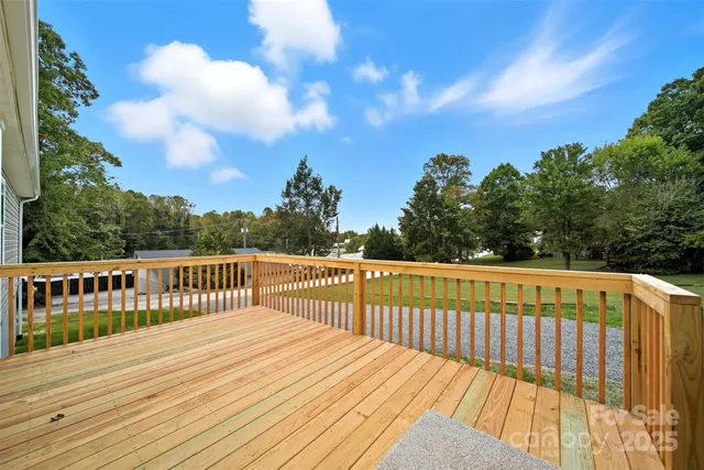 a view of deck and a yard