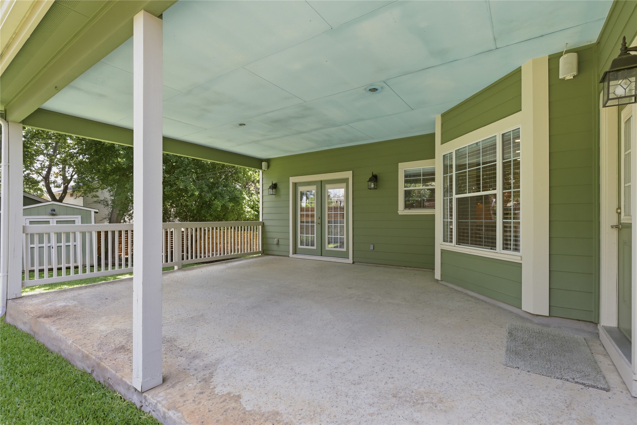 1204 Orlando Road Austin, TX 78733 - Photo 15 of 40 An inviting covered patio offers ample space for outdoor enjoyment and relaxation.