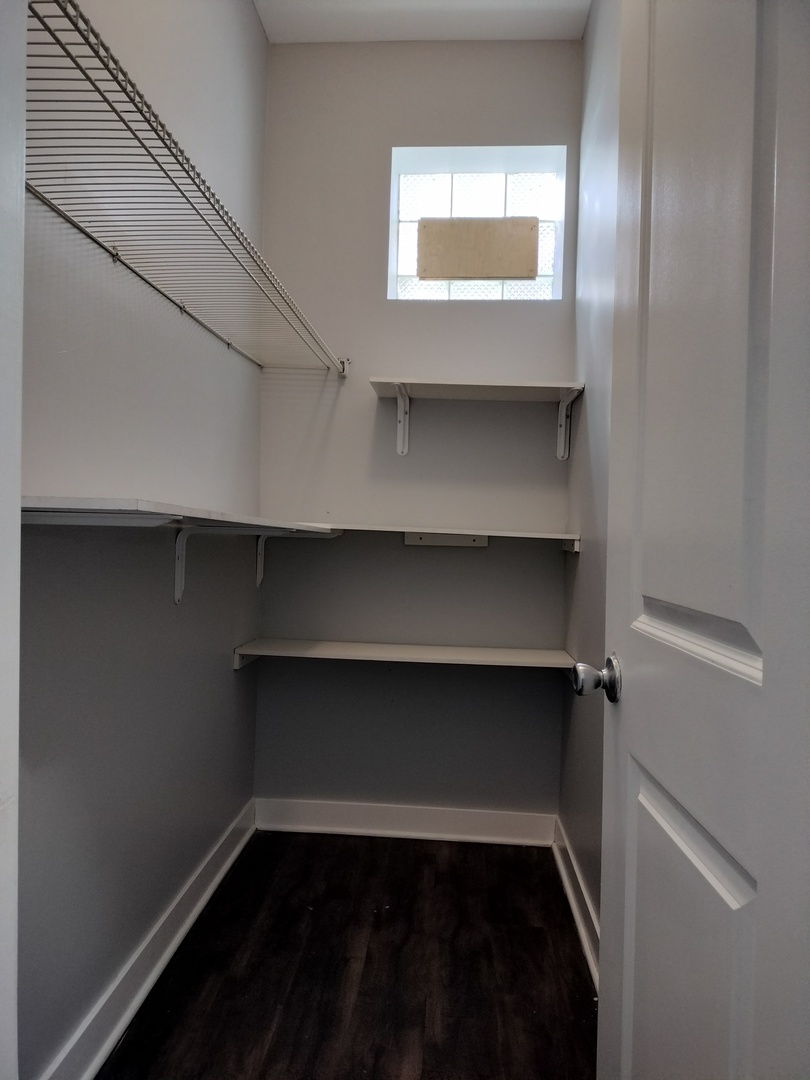 1945 West 48th Street, Unit 2 Chicago, IL 60609 - Photo 17 of 19 a view of a room with rack on the wall