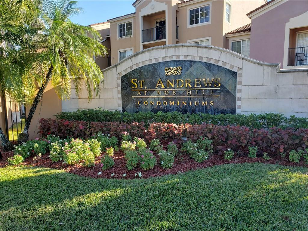 7930 North Nob Hill Road, Unit 3305 Tamarac, FL 33321 - Photo 1 of 28 a sign on the side of a building