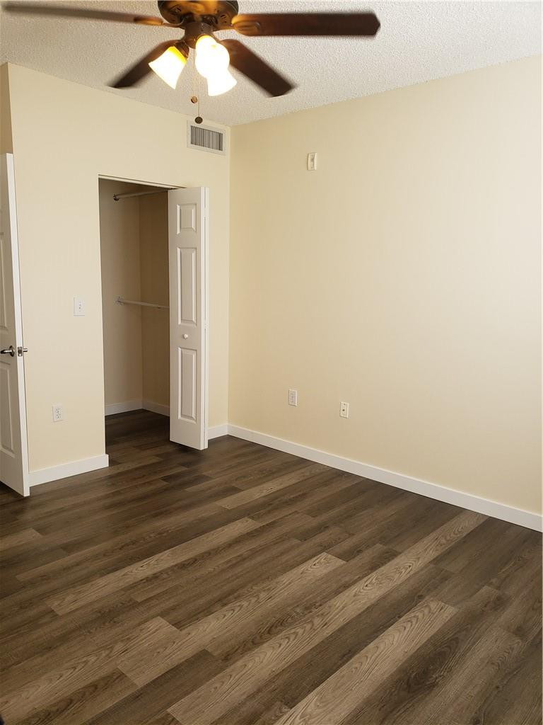 7930 North Nob Hill Road, Unit 3305 Tamarac, FL 33321 - Photo 12 of 28 wooden floor in an empty room