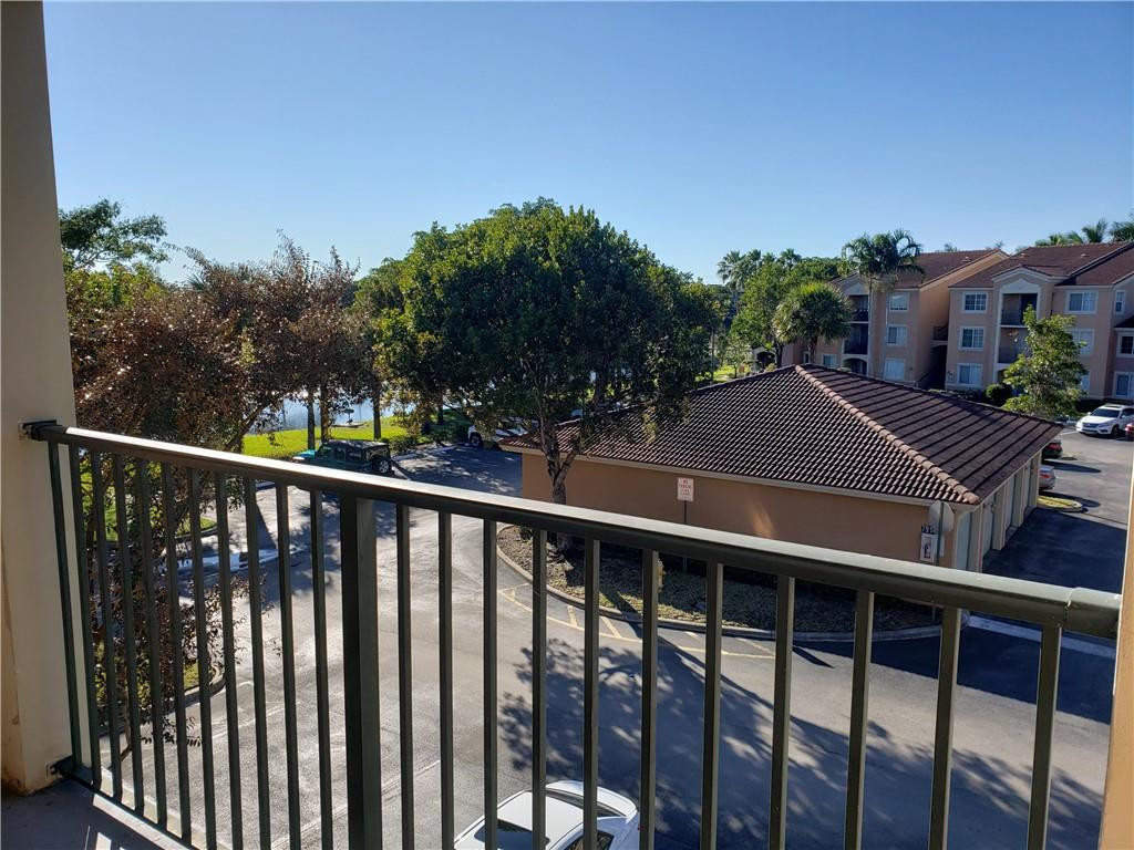 7930 North Nob Hill Road, Unit 3305 Tamarac, FL 33321 - Photo 16 of 28 a view of a balcony with outdoor space