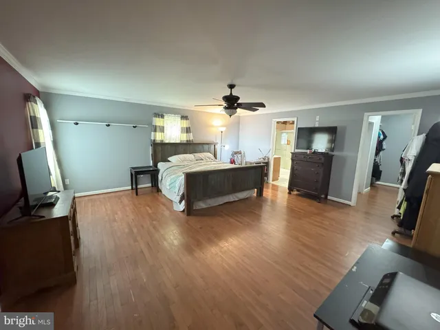 a bedroom with bed and window