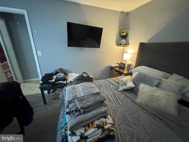 a bedroom with a bed and furniture