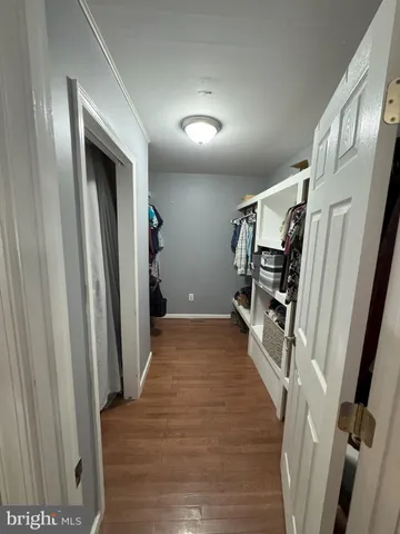 a bathroom with a sink mirror vanity and toilet