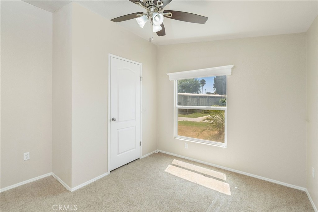 5800 Hamner Avenue, Unit 156 Eastvale, CA 91752 - Photo 14 of 20 a view of an empty room with a window