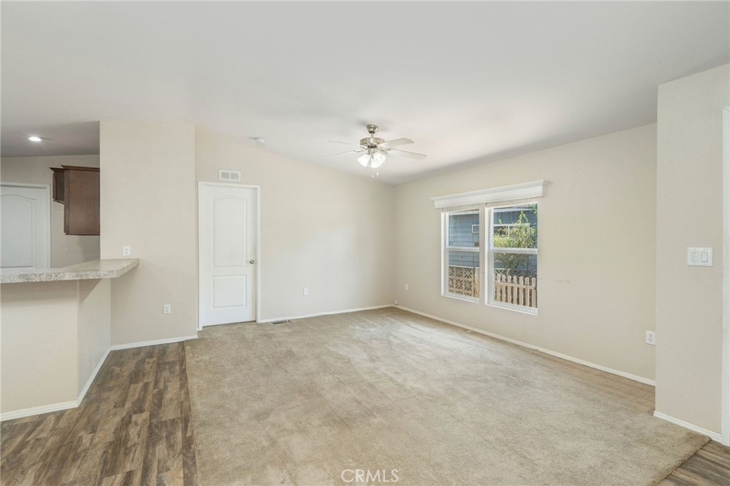 5800 Hamner Avenue, Unit 156 Eastvale, CA 91752 - Photo 3 of 20 a view of an empty room with a window