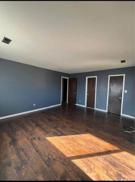 15 Park Avenue, Unit 302B Spring Valley, NY 10977 - Photo 3 of 7 a view of a livingroom with wooden floor