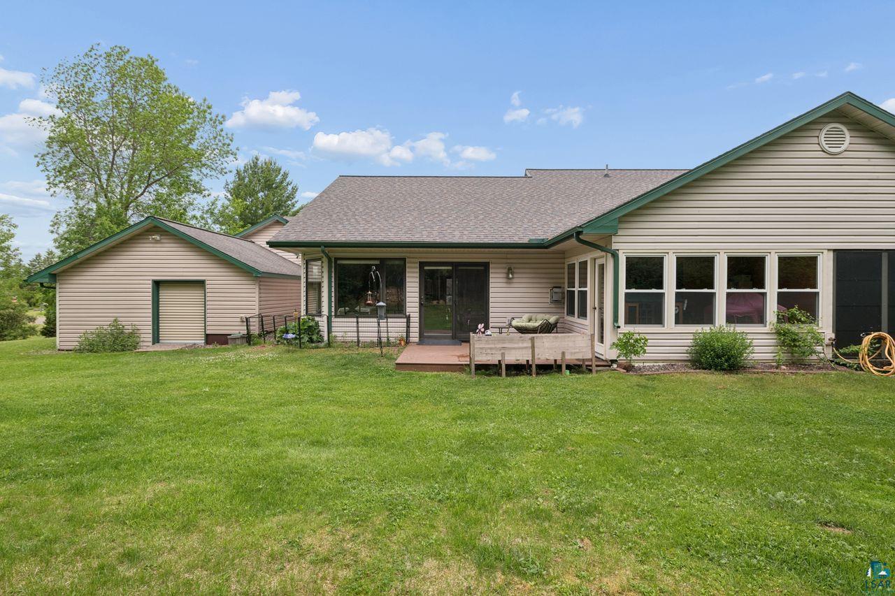 202 Prentice Heights Road Ashland, WI 54806 - Photo 21 of 28 Rear exterior featuring beige horizontal siding and green trim