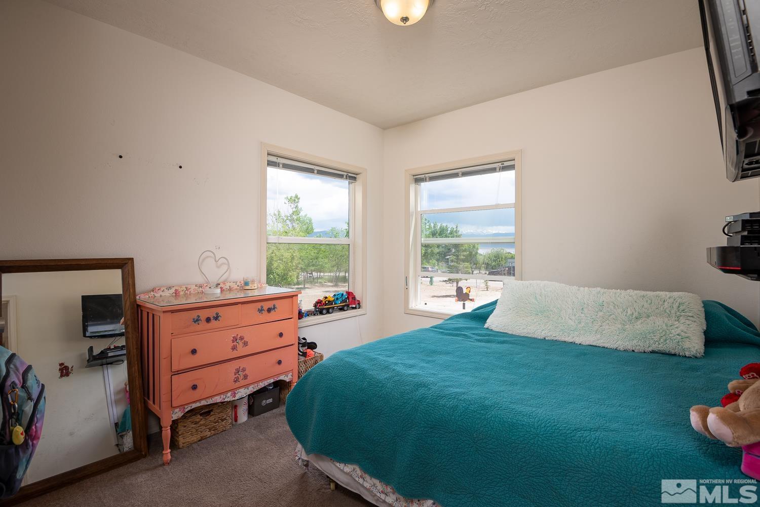 3904 Walker View Road Wellington, NV 89444 - Photo 15 of 37 a bed room with a bed and a window