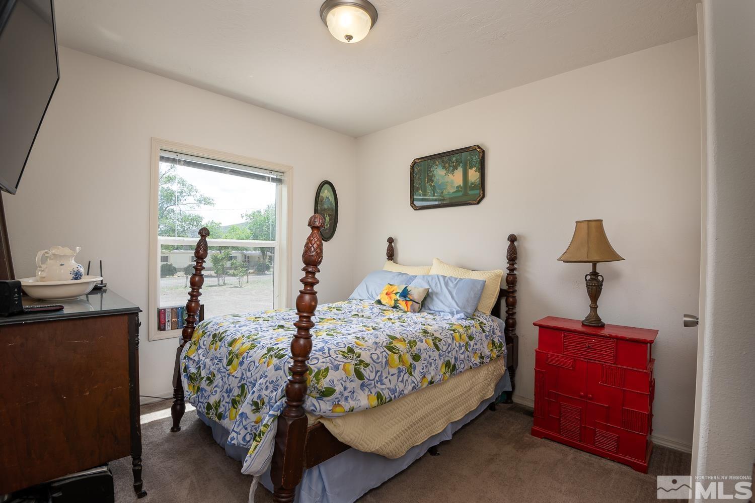 3904 Walker View Road Wellington, NV 89444 - Photo 18 of 37 a bedroom with a bed and wooden floor