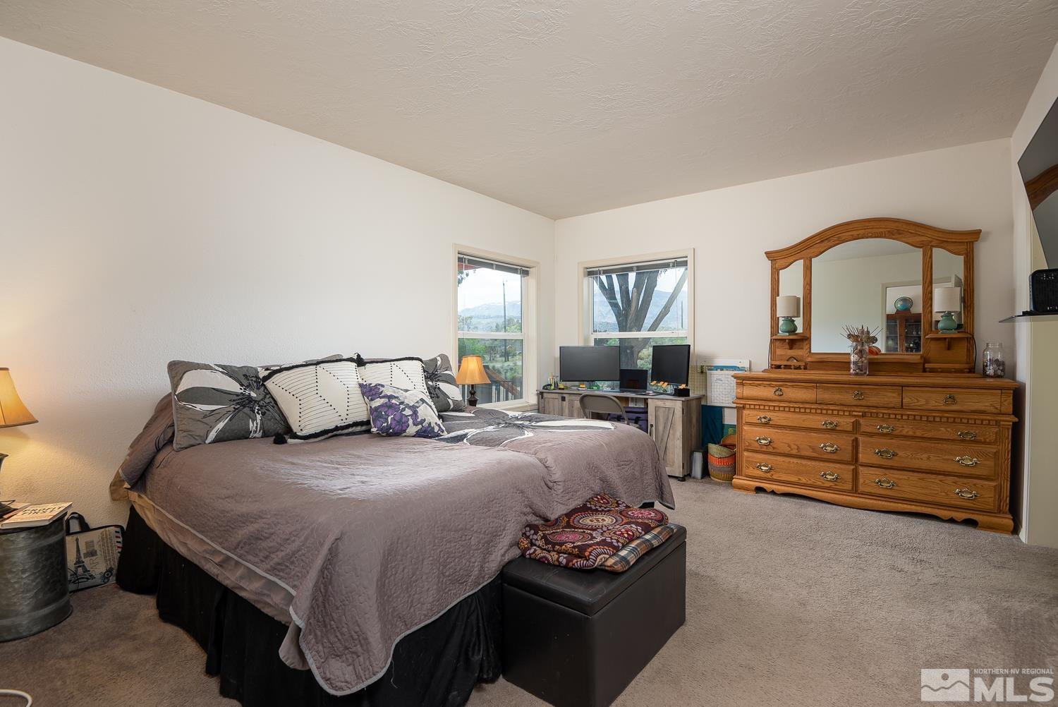 3904 Walker View Road Wellington, NV 89444 - Photo 22 of 37 a bedroom with a bed and a dresser