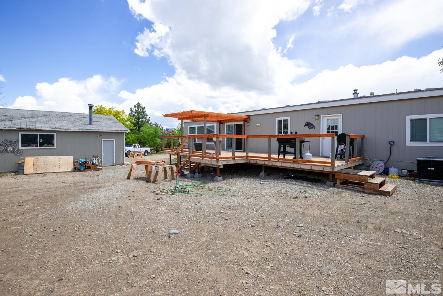 3904 Walker View Road Wellington, NV 89444 - Photo 31 of 37 a view of a house with sitting area and roof deck