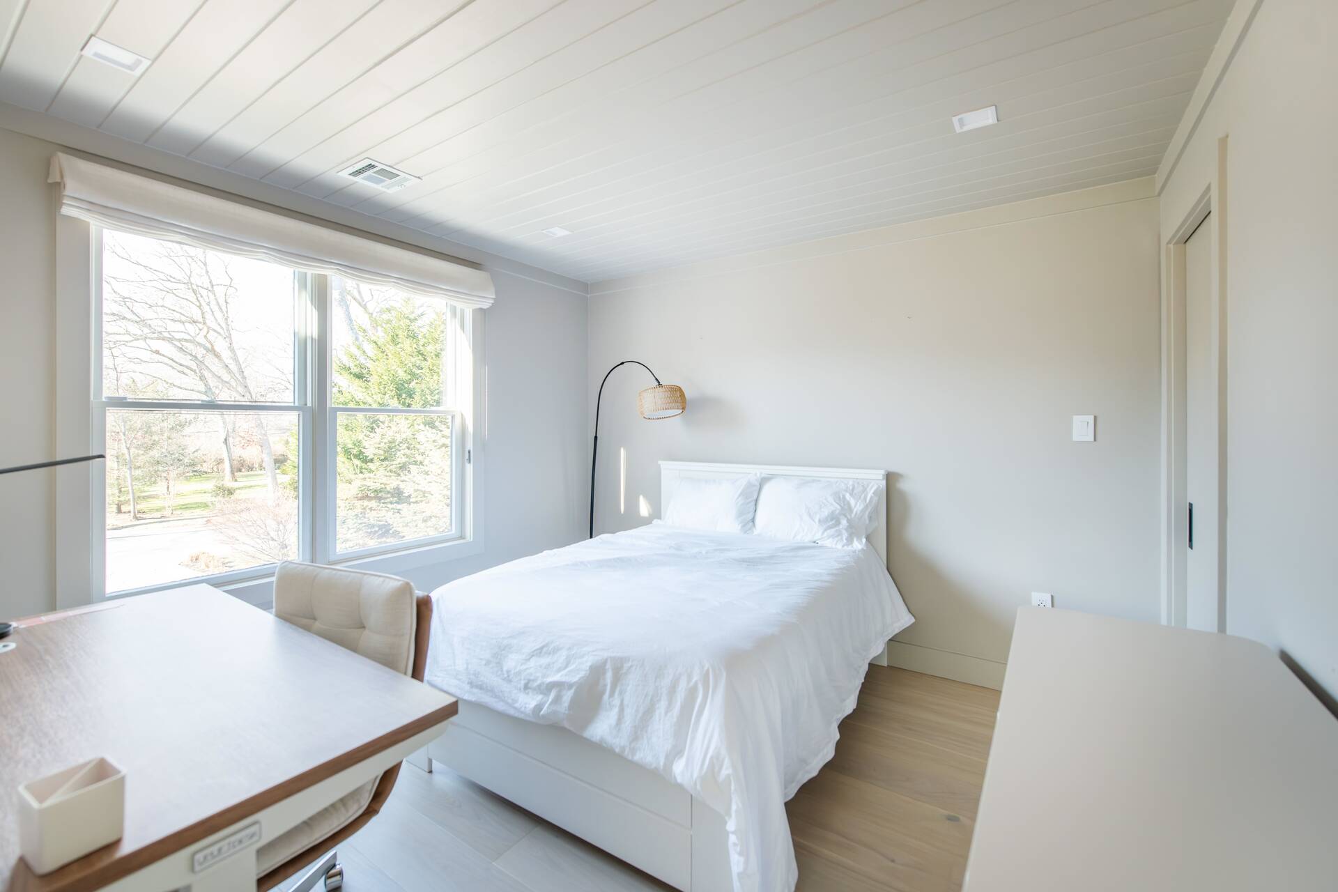 42 Knoll Road Southampton, NY 11968 - Photo 13 of 18 a bedroom with a bed and a large window