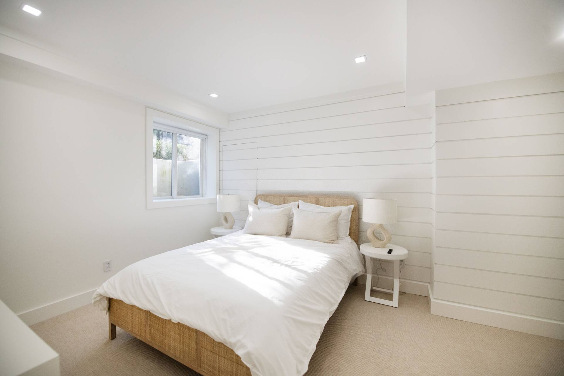 42 Knoll Road Southampton, NY 11968 - Photo 15 of 18 a bedroom with a bed and a window