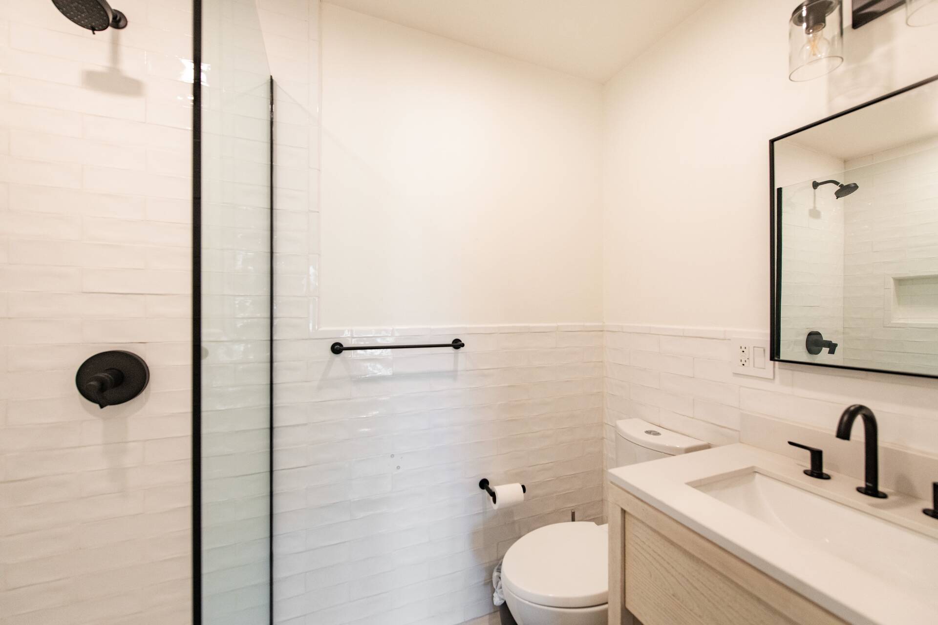 42 Knoll Road Southampton, NY 11968 - Photo 18 of 18 a bathroom with a toilet sink vanity and shower