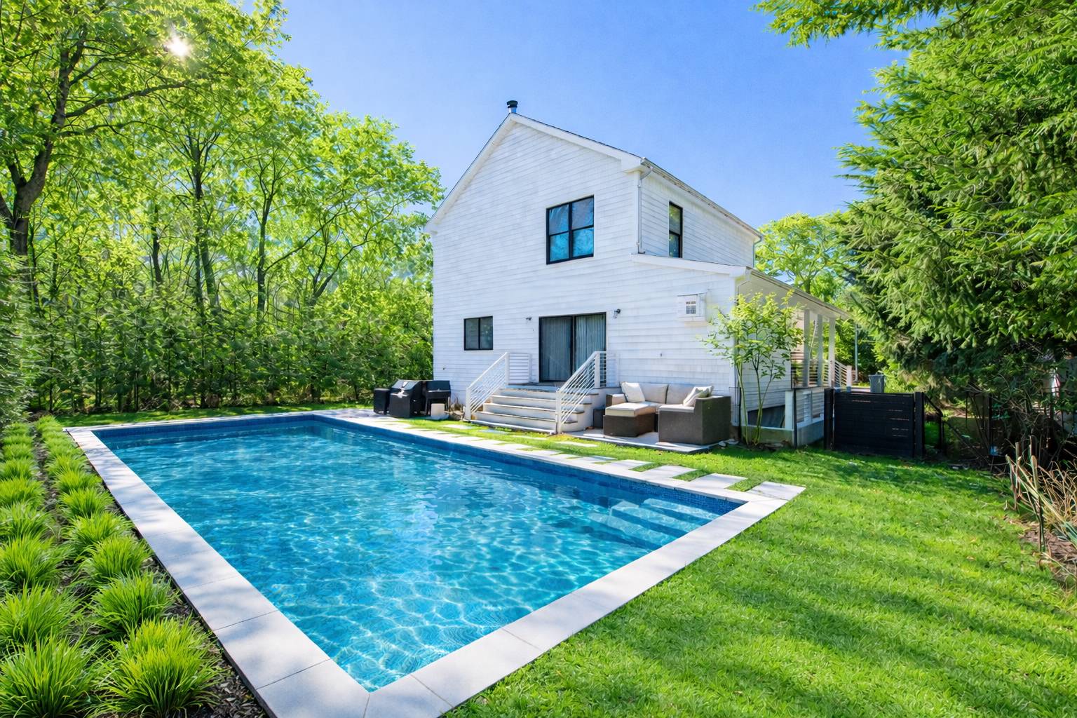 42 Knoll Road Southampton, NY 11968 - Photo 2 of 18 a view of a house with swimming pool and a yard