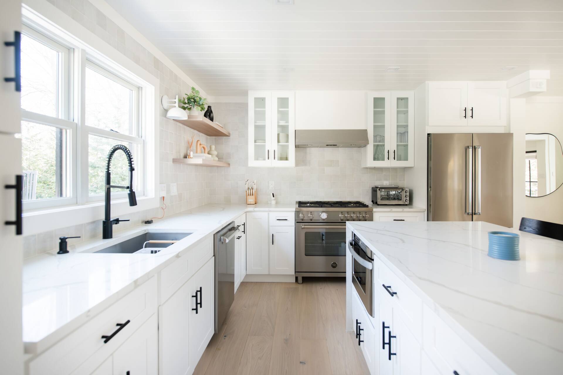 42 Knoll Road Southampton, NY 11968 - Photo 8 of 18 a kitchen with a sink a stove a refrigerator and cabinets
