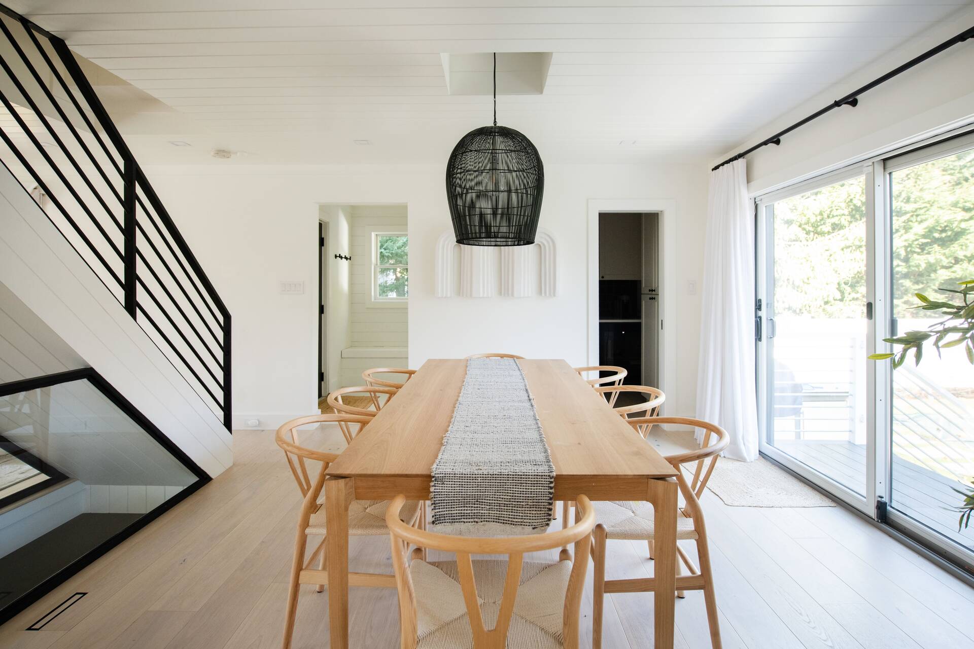 42 Knoll Road Southampton, NY 11968 - Photo 9 of 18 a view of a dining room with furniture and wooden floor