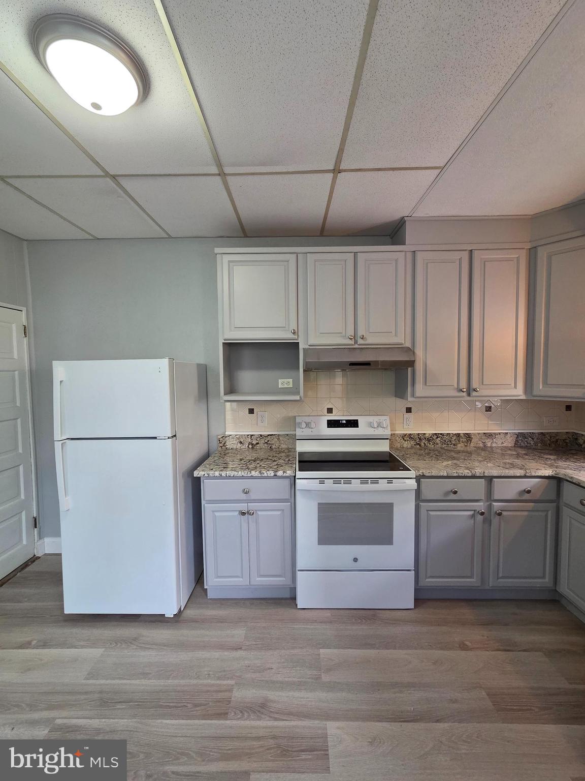 1440 Friedensburg Road Reading, PA 19606 - Photo 13 of 41 a kitchen with stainless steel appliances granite countertop a stove sink and cabinets