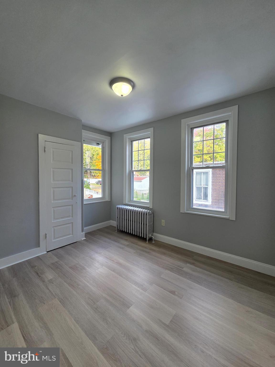 1440 Friedensburg Road Reading, PA 19606 - Photo 18 of 41 a view of an empty room with wooden floor and a window
