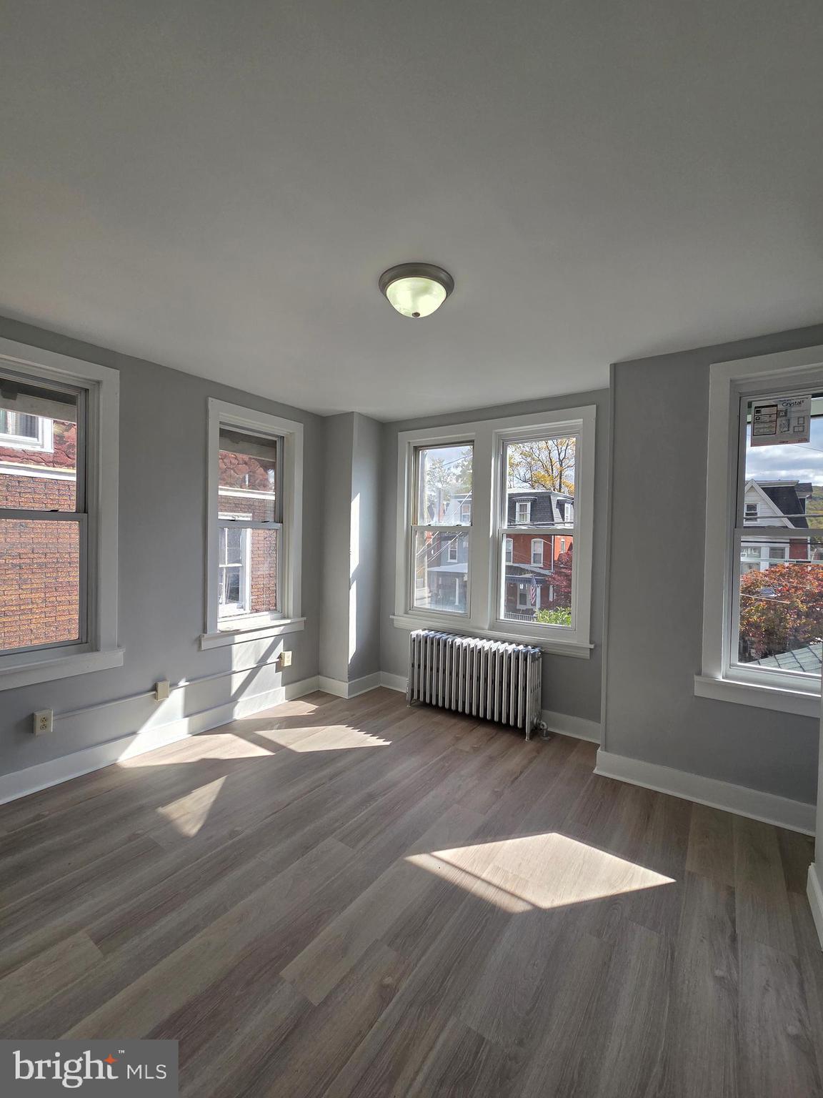 1440 Friedensburg Road Reading, PA 19606 - Photo 24 of 41 an empty room with wooden floor and windows