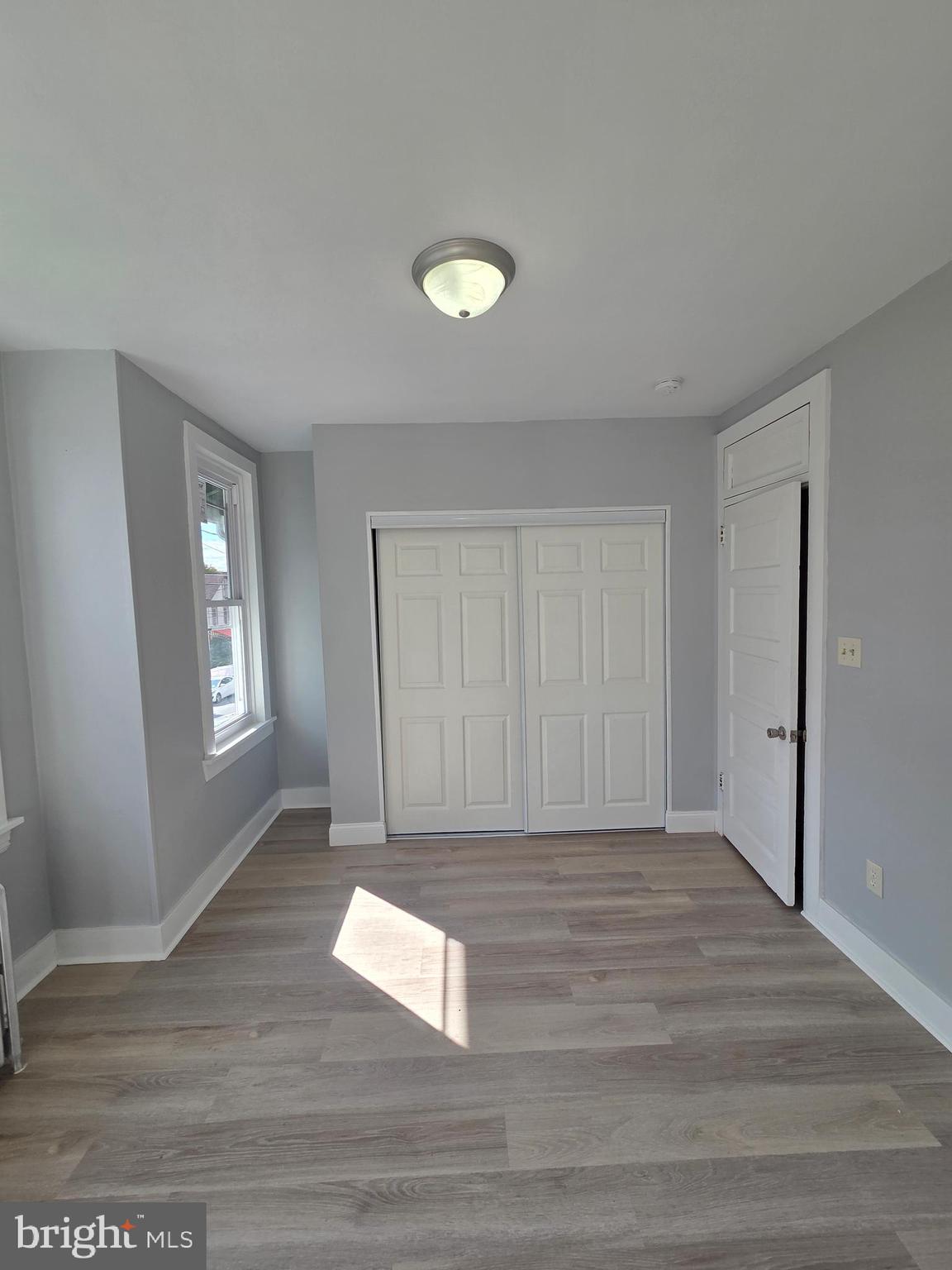 1440 Friedensburg Road Reading, PA 19606 - Photo 25 of 41 a view of an empty room with wooden floor and a window