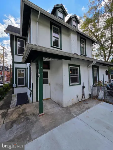 a view of a patio with table and chairs and potted plants