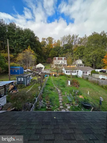 a view of entryway with wooden floor and stairs