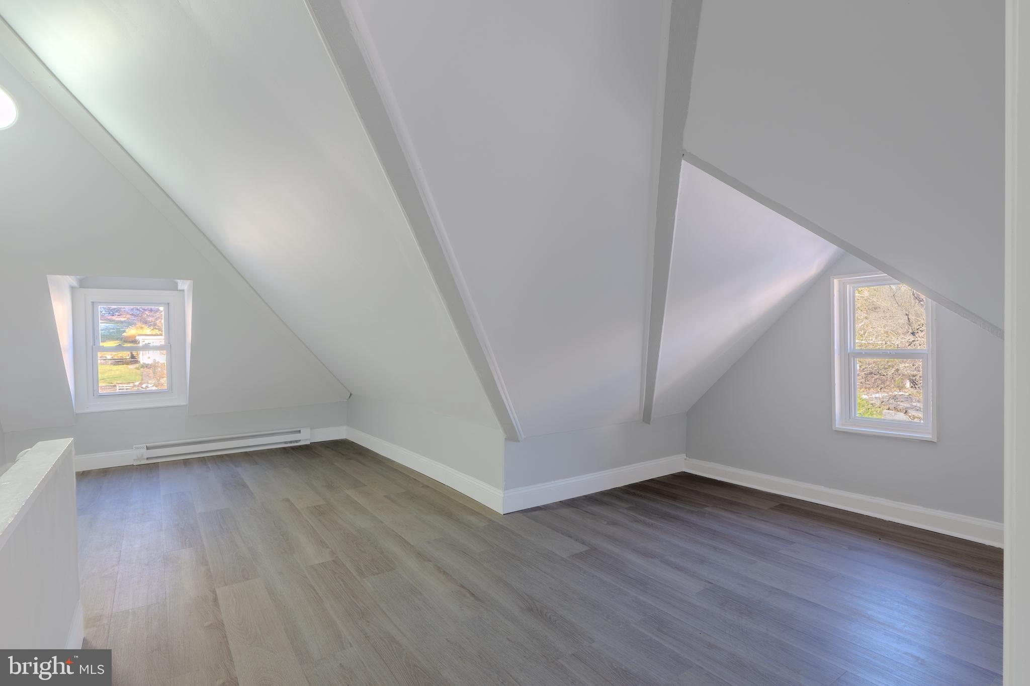 1440 Friedensburg Road Reading, PA 19606 - Photo 41 of 41 an empty room with wooden floor and windows