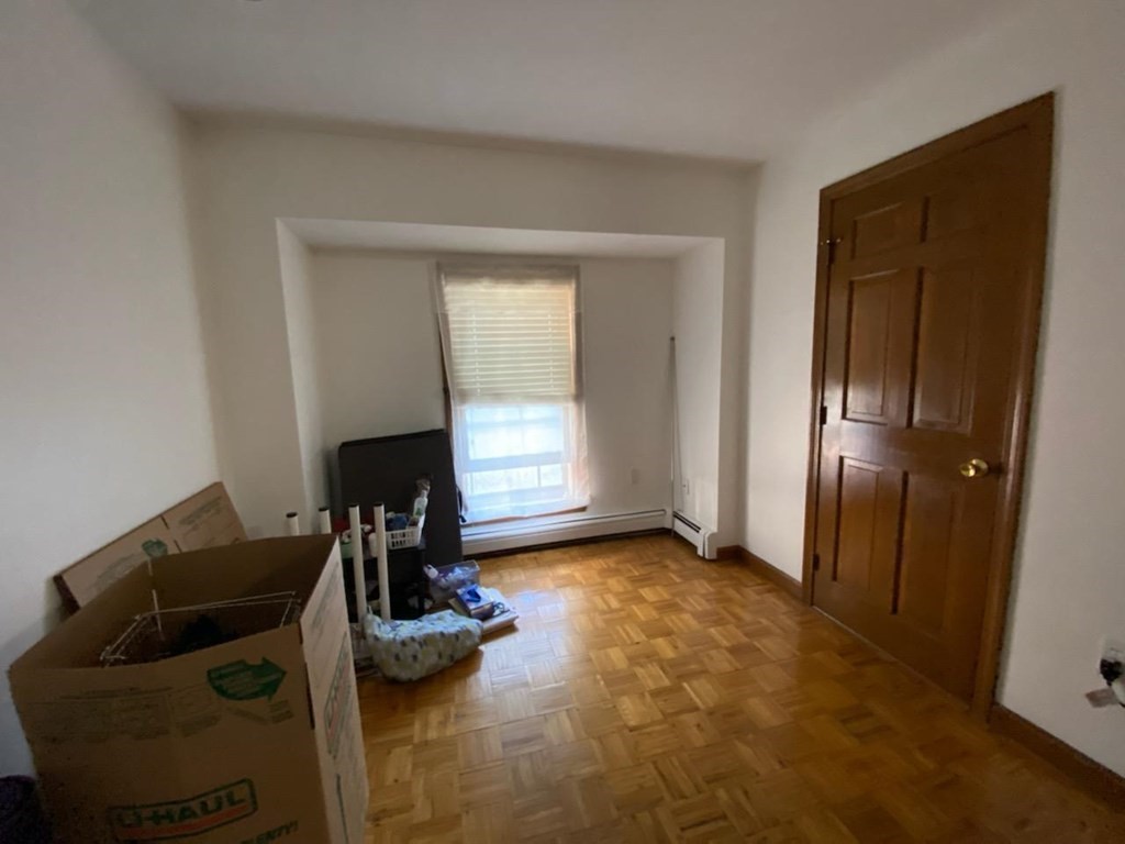548 Pleasant Street, Unit 2R Worcester, MA 01602 - Photo 4 of 5 a room with furniture and gym equipment