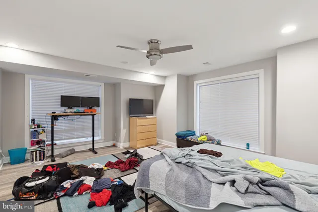 a bedroom with bed and a window