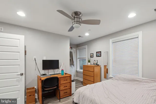 a bedroom with a bed and a television