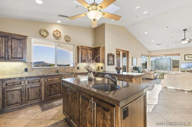 a spacious bedroom with a large bed and a large window