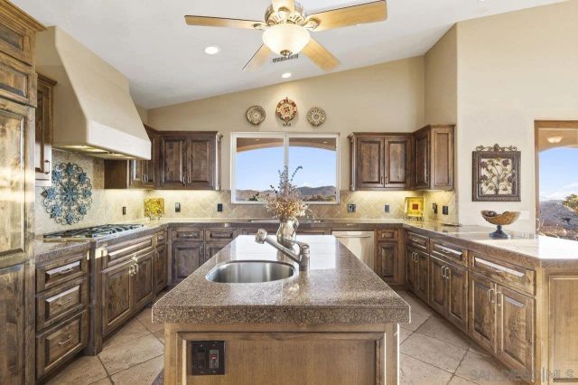 a bathroom with a double vanity sink a mirror and a bathtub