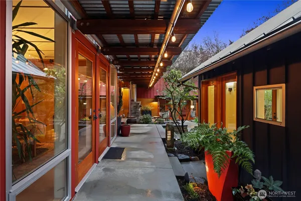 a view of a porch with potted plants