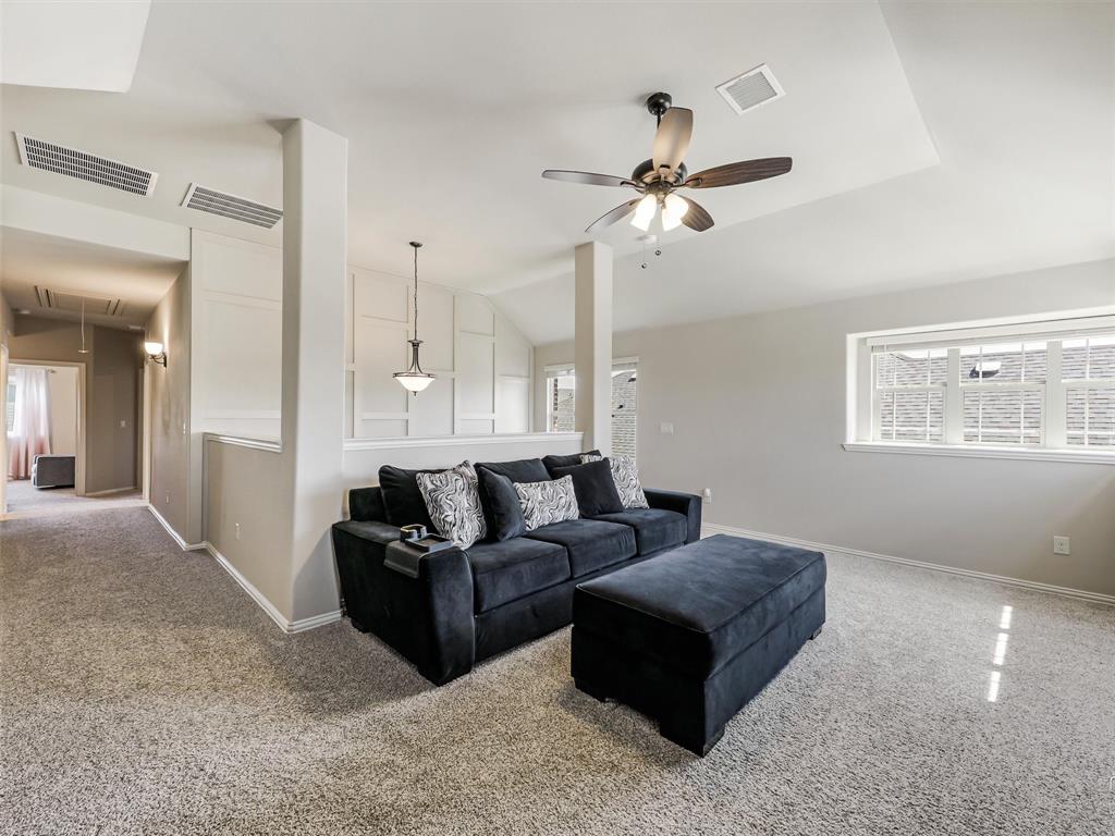 1216 Tree Shadow Lane Anna, TX 75409 - Photo 25 of 37 a living room with couches and ceiling fan with wooden floor