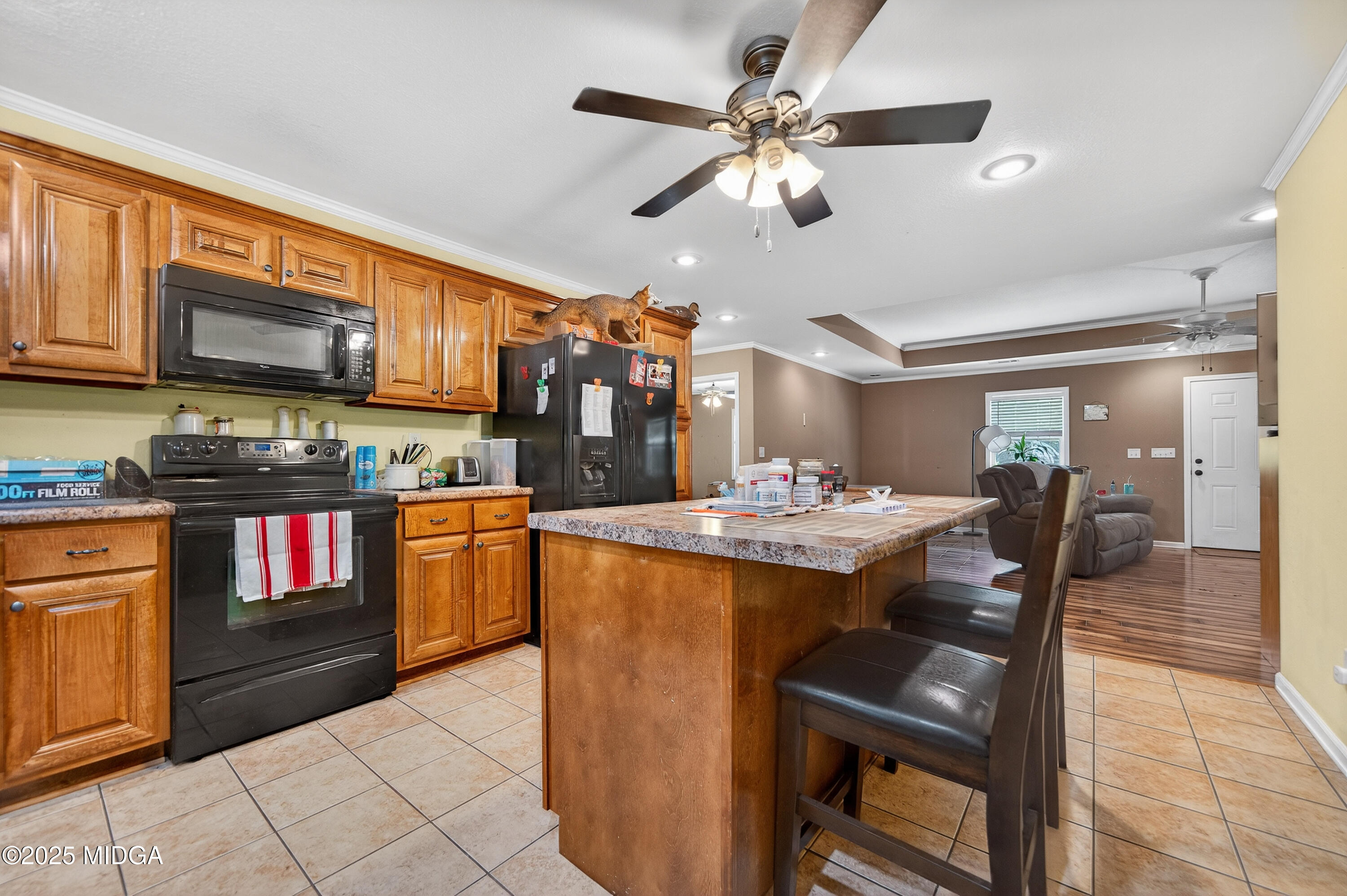 1866 McLendon Road Dublin, GA 31021 - Photo 17 of 48 a kitchen with stainless steel appliances kitchen island granite countertop a sink and cabinets