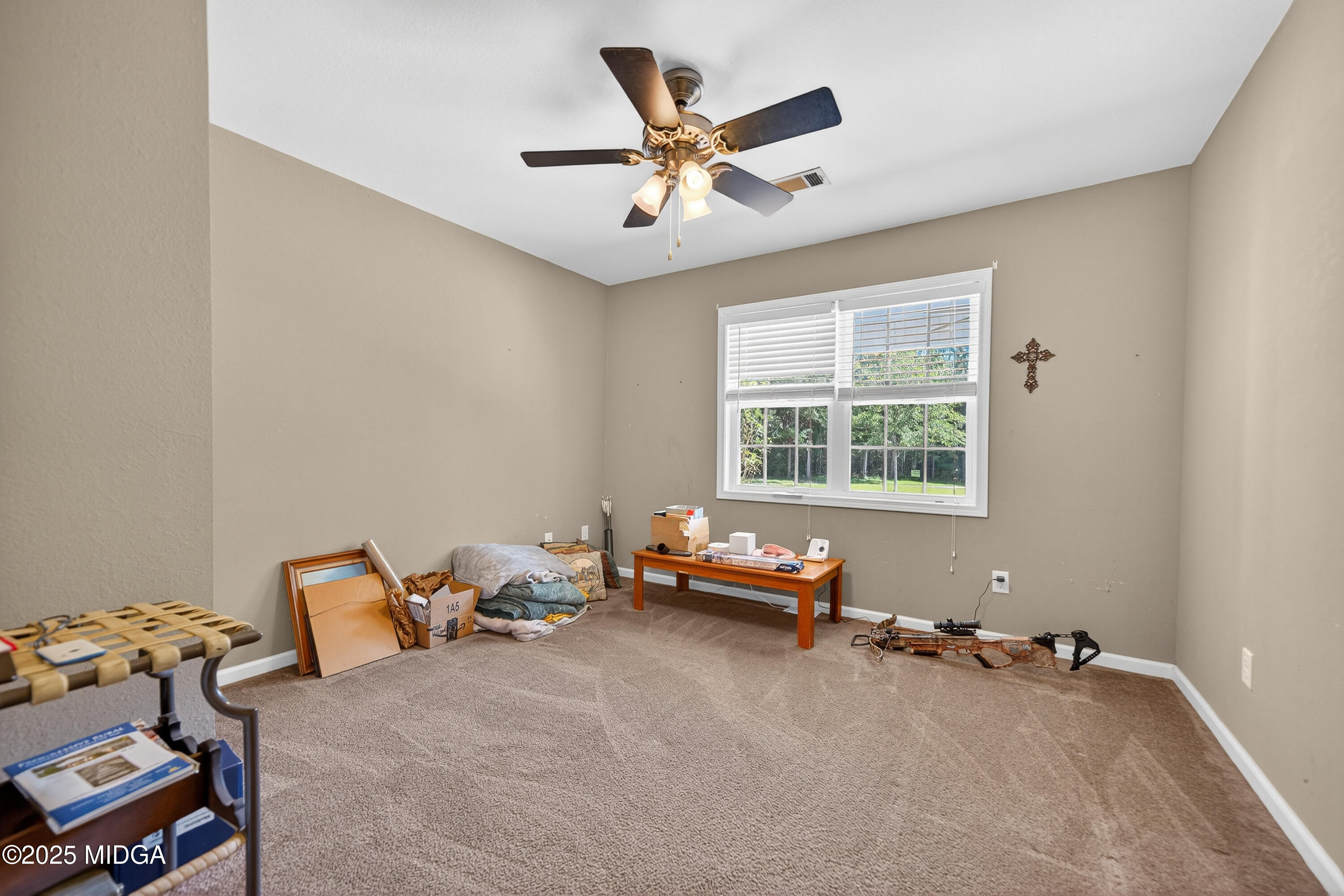 1866 McLendon Road Dublin, GA 31021 - Photo 18 of 48 a living room with furniture and a window