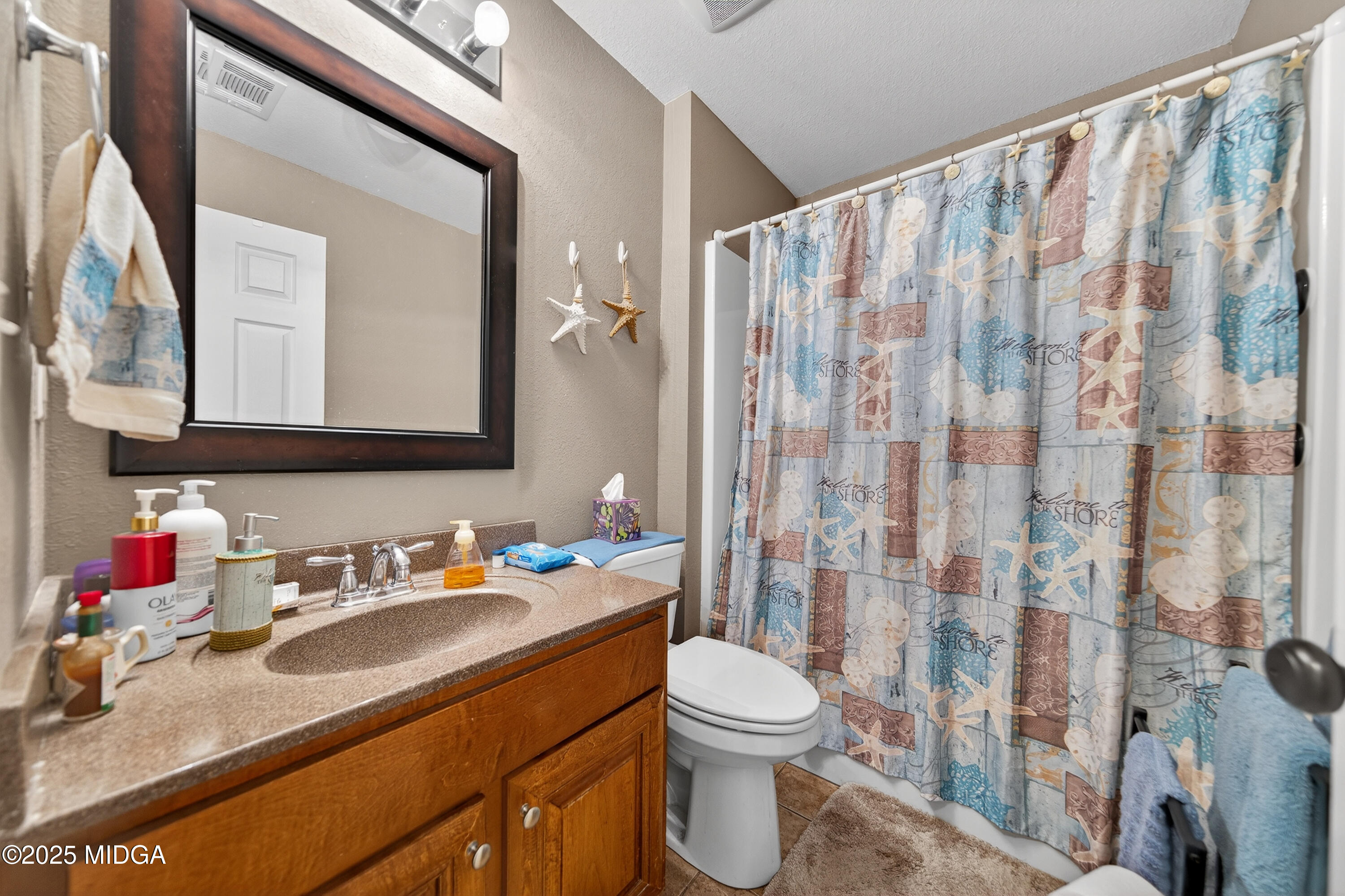 1866 McLendon Road Dublin, GA 31021 - Photo 20 of 48 a bathroom with a sink vanity mirror and toilet