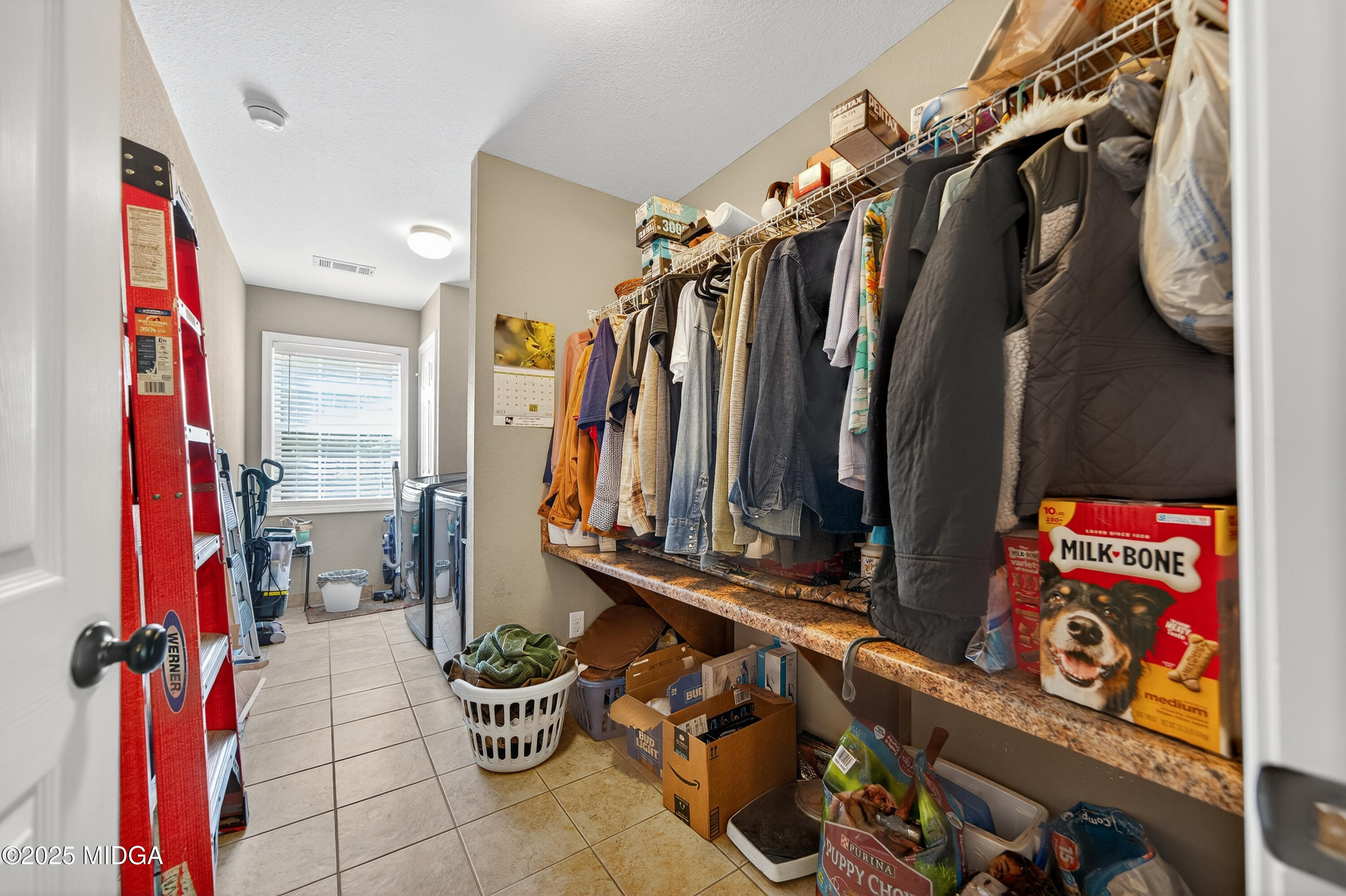 1866 McLendon Road Dublin, GA 31021 - Photo 25 of 48 a view of walk in closet with clothes and shoes