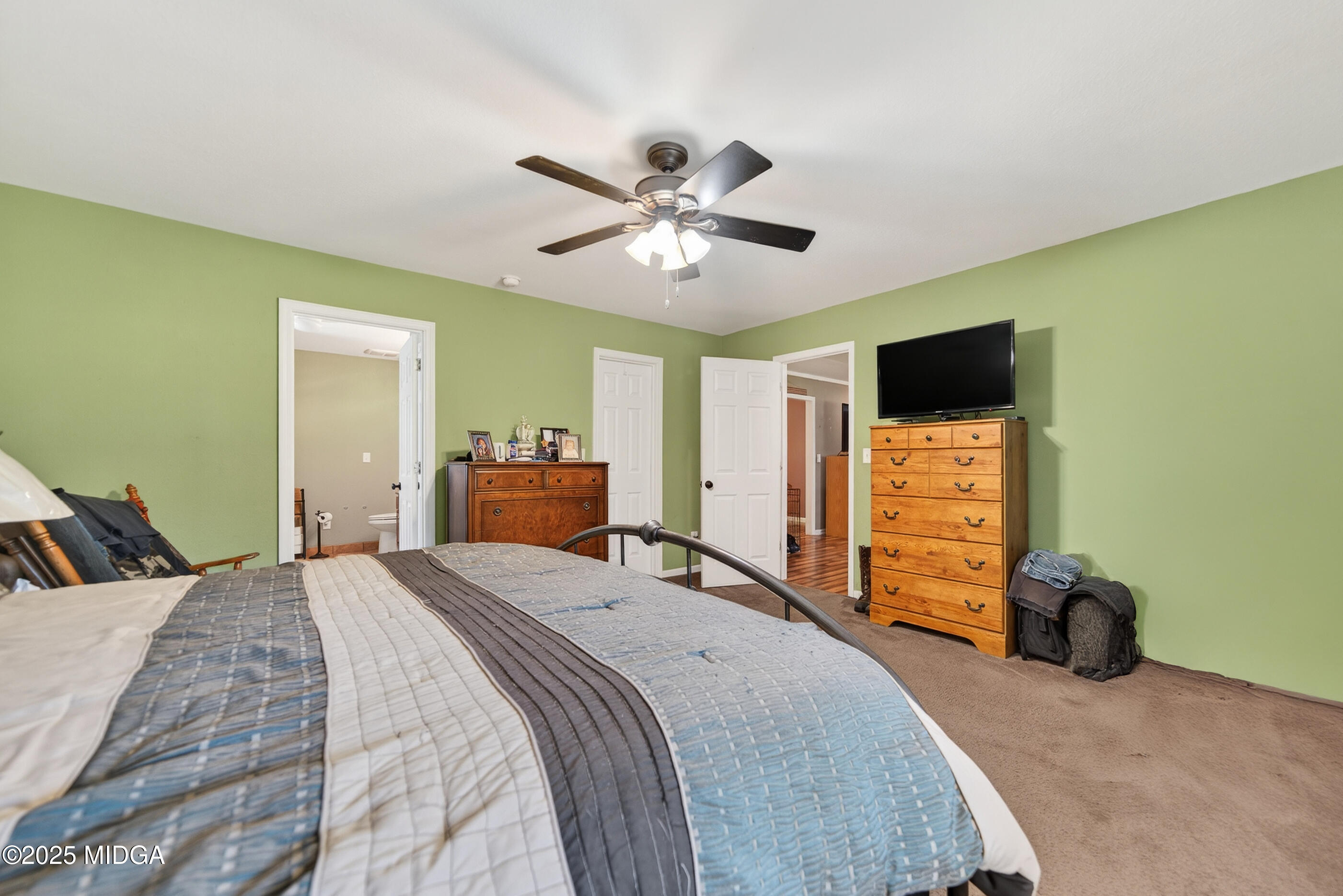 1866 McLendon Road Dublin, GA 31021 - Photo 27 of 48 a bedroom with a bed and a television