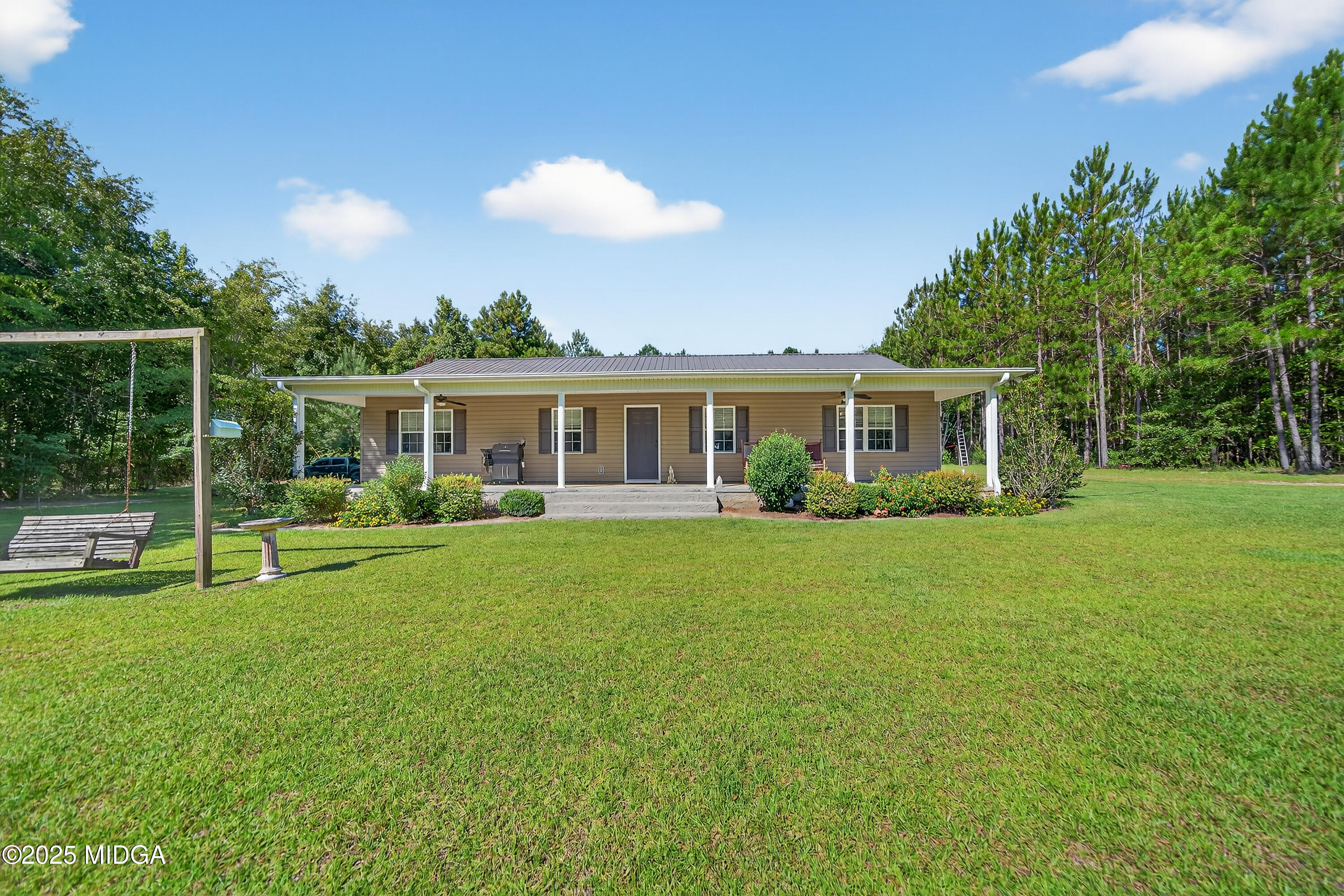 1866 McLendon Road Dublin, GA 31021 - Photo 4 of 48 a view of an house with backyard space and balcony