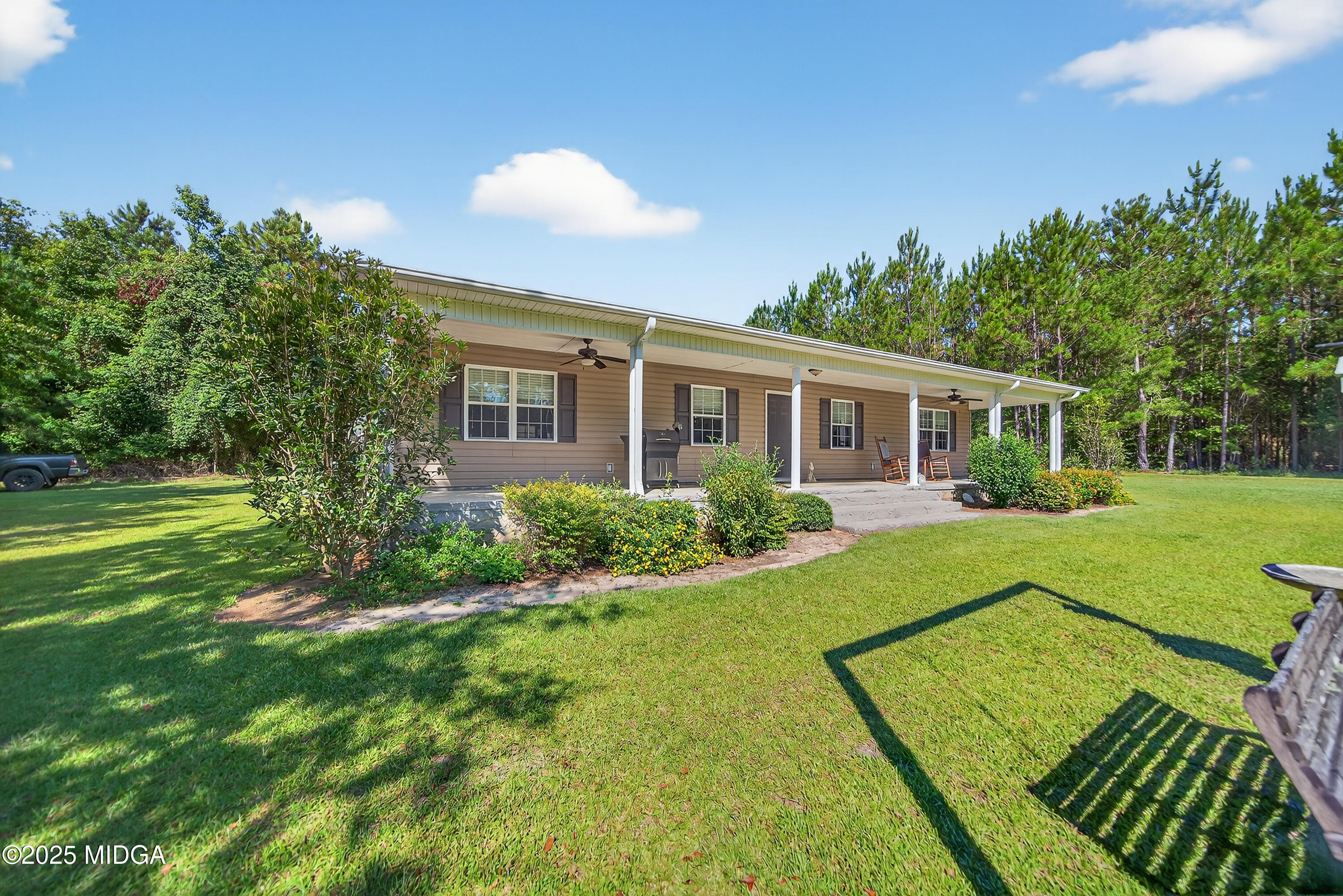 1866 McLendon Road Dublin, GA 31021 - Photo 5 of 48 a view of a house with a backyard