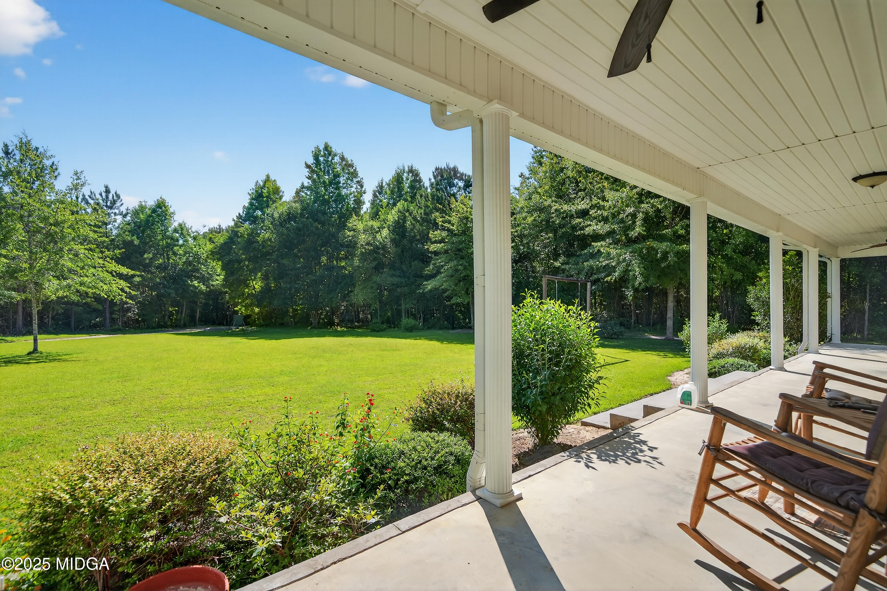 1866 McLendon Road Dublin, GA 31021 - Photo 7 of 48 a view of a swimming pool with an outdoor seating