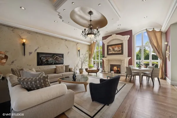 a kitchen with kitchen island granite countertop a sink counter top space appliances and cabinets