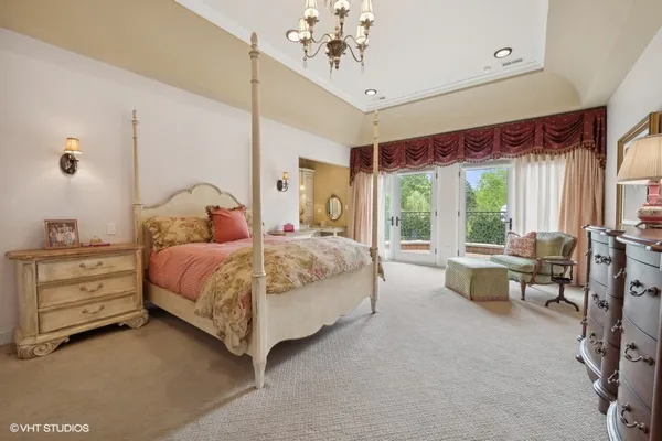 a bathroom with a granite countertop sink toilet mirror and shower