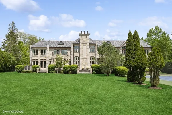 a view of a backyard with sitting area